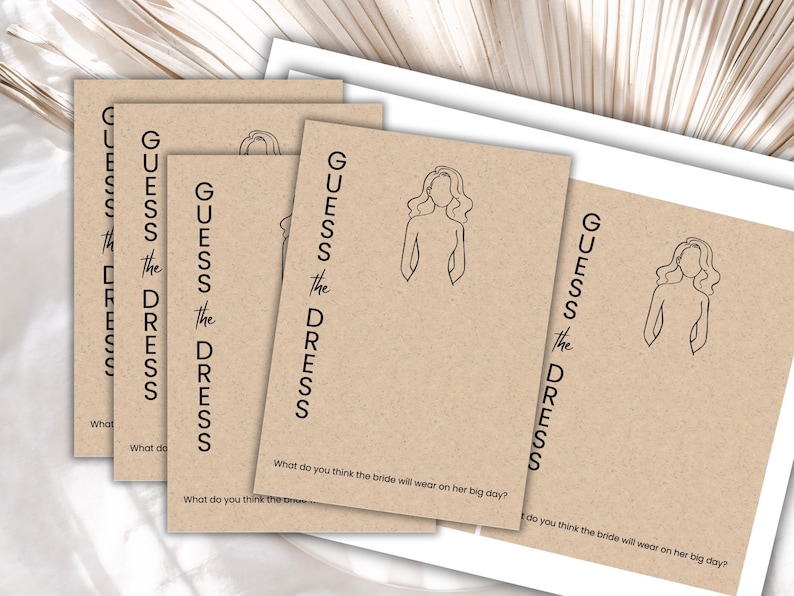 May include: Four brown cards with the text "GUESS THE DRESS" and a line drawing of a woman in a dress. The text "What do you think the bride will wear on her big day?" is printed on each card.