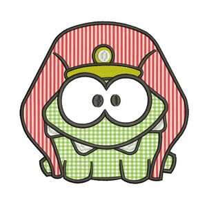 May include: A green cartoon character with large eyes and a toothy grin, wearing a red and white striped hat with a yellow crown. The character is in a green and white checkered pattern.
