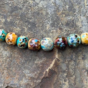 Abstract surface - 8 Lampwork glass beads with crushed glass designs