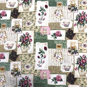 May include: A patchwork fabric featuring floral and tea-themed designs. The pattern includes images of teacups, teapots, and bouquets of flowers in shades of pink, purple, and green. The background has a mix of floral, striped, and checkered patterns.