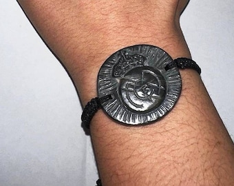 Medicine bracelet with shield