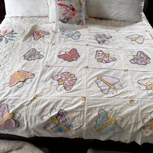 Sweet little vintage butterfly quilt top. 52”x53”. Thin fabric.  Some butterflies are missing, but I have all of the original ones.  See pic