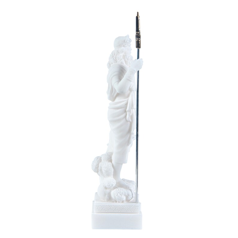 May include: White marble statue of a Greek god holding a spear, standing on a base with a Greek key design.