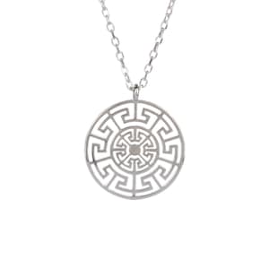 May include: Silver necklace with a circular pendant featuring a geometric design inspired by a Greek key pattern.