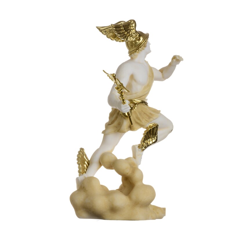 May include: A white marble statue of a Greek god with gold accents. The god is depicted running with wings on his helmet and sandals. He is holding a golden staff in his hand. The statue is standing on a cloud-shaped base.
