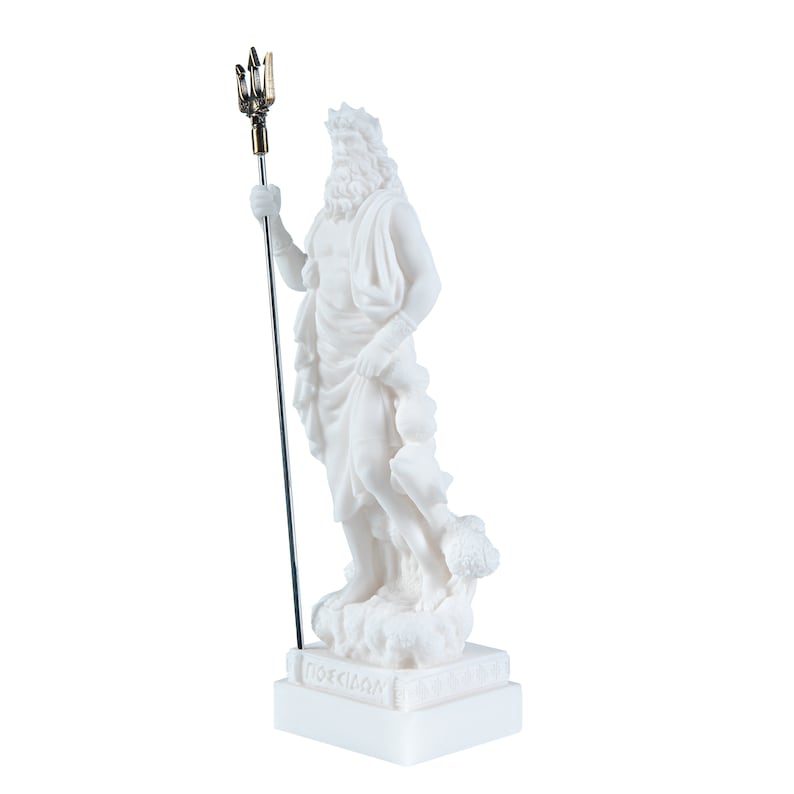 May include: White marble statue of Poseidon, the Greek god of the sea, holding a trident. The statue is standing on a white base with the word "POSEIDON" inscribed on it.