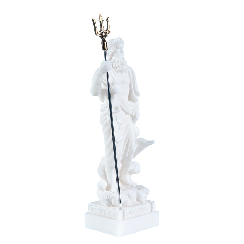 May include: White marble statue of Poseidon, the Greek god of the sea, holding a trident. The statue is standing on a square base with Greek lettering.
