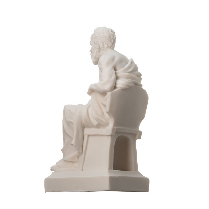 May include: White marble statue of a seated man wearing a toga. The statue is a replica of a classical Greek sculpture.
