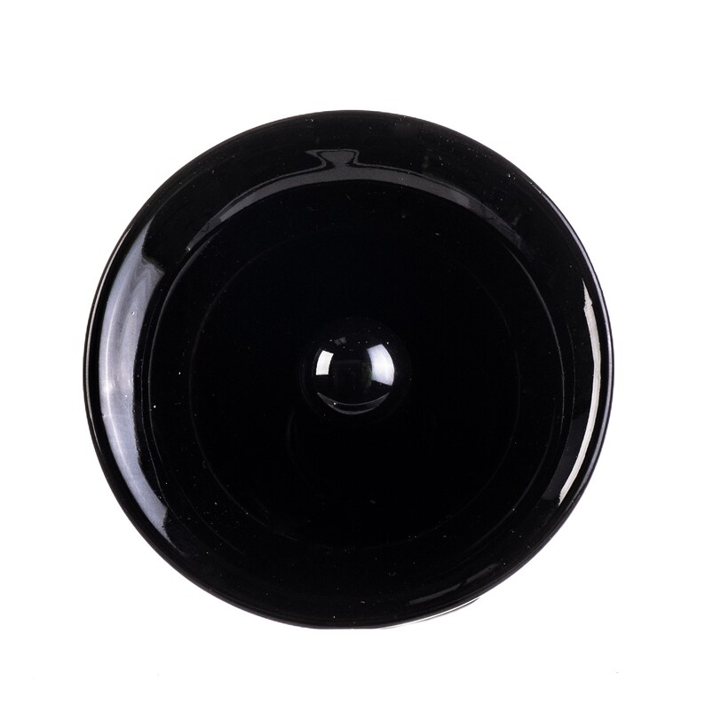 May include: A glossy black bottle stopper with a rounded top and a small, spherical knob. The stopper is designed to fit snugly into a bottle opening. The design is simple and elegant, suitable for various bottle types.