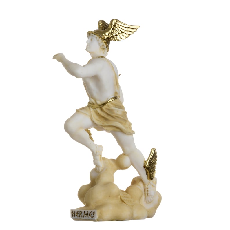 May include: A white marble statue of Hermes, the Greek god of messengers, with gold accents. He is depicted running with wings on his sandals and a winged helmet. The statue is standing on a cloud base with the word "HERMES" inscribed on the front.