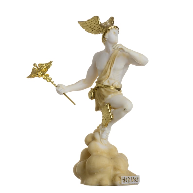 May include: A white marble statue of Hermes, the Greek god of messengers, with gold accents. He is depicted standing on a cloud, holding a caduceus, a staff with two snakes intertwined around it, in his right hand. The statue is inscribed with the word "HERMES" at the base.