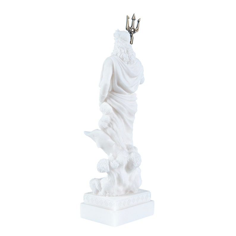 May include: White marble statue of Poseidon, the Greek god of the sea, holding a trident. The statue is standing on a base with a Greek key design. The statue is about 12 inches tall.