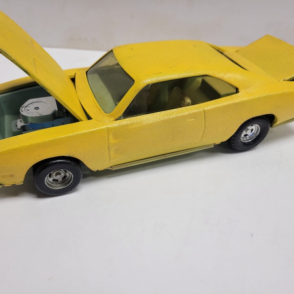 Vintage and RARE  Ertl diecast friction toy car called The Stinger which is a 1969, Mopar,  Dodge Charger R/T ,   1/18 Scale