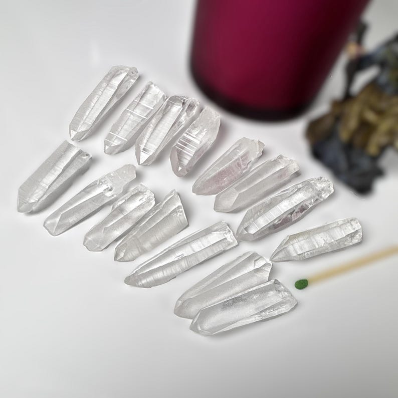 15 pieces Raw Lemurian Seed Crystal points from Brazil.
You choose the exact 15 pieces from the drop down menu.  
all items are under 100 grams in weight total.
63 grams
15 pieces
baby Lemurian quartz crystals