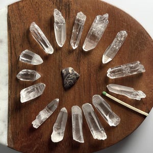 Material: Quartz 
Variety: Lemurian Seed Quartz Crystals 
Quantity: 15
Weight: 58.4 grams
Country of origin: Brazil
Ships from : USA