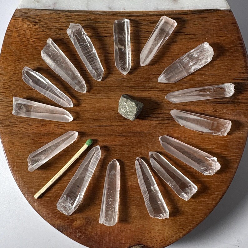 Material: Quartz 
Variety: Lemurian Seed Quartz Crystals 
Quantity: 15
Weight: 61.4 grams
Country of origin: Brazil
Ships from : USA