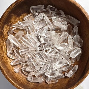 May include: A set of three ceramic mugs with a speckled, matte finish. The mugs are in shades of cream, light gray, and dark gray. Each mug has a simple, minimalist design, perfect for coffee or tea.