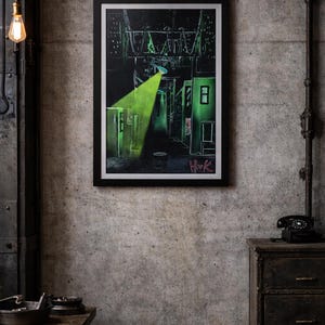 May include: Framed artwork showing a neon green spotlight in a dark alleyway. The artwork features buildings and the word "Hook". The artwork is displayed on a textured grey concrete wall. The overall theme is urban art.