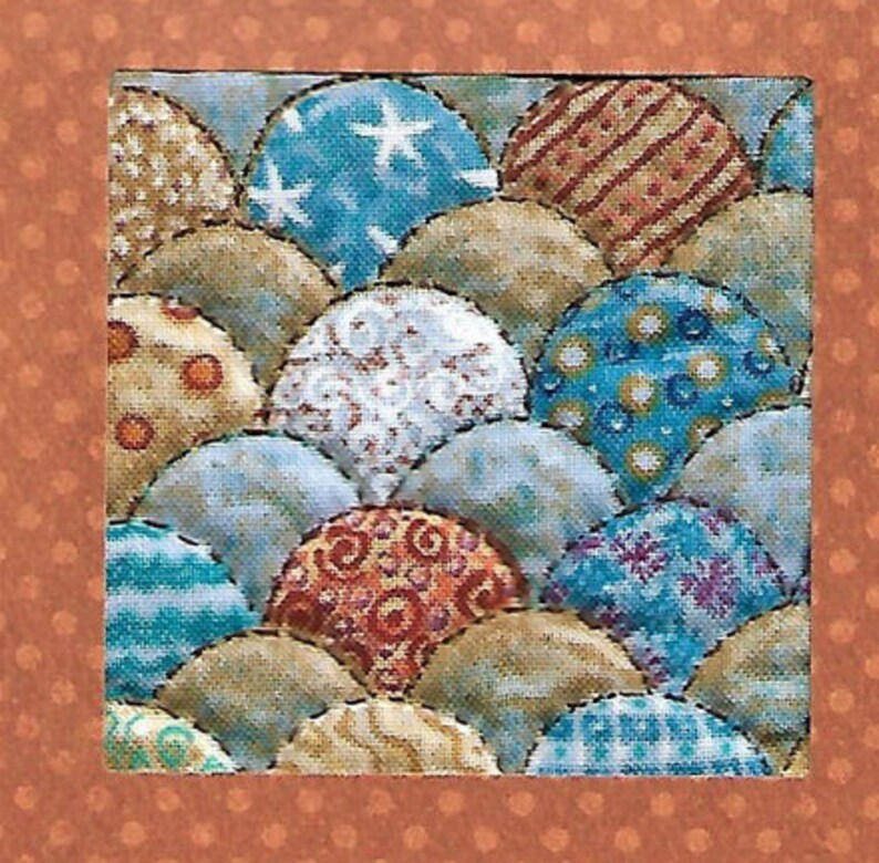May include: A square textile piece featuring a repeating pattern of overlapping, semi-circular shapes. The shapes are filled with various patterns, including stars, stripes, and floral designs, in shades of blue, tan, and red. The border is a solid orange with small white dots.