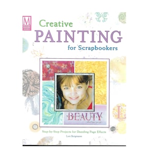 May include: Book cover with a purple title "Creative Painting for Scrapbookers" and a photo of a young girl with a red shirt. The book cover has a colorful background with a variety of textures and patterns.