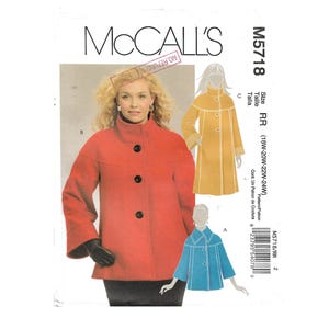 May include: A McCall's M5718 sewing pattern envelope featuring a red coat with a high collar and three black buttons. Illustrations show a longer yellow coat and a shorter blue coat. The text includes McCall's, M5718, and size RR 18W-24W.