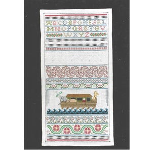 May include: A rectangular, embroidered sampler with a black border. The top features the alphabet in red and green. Below are decorative patterns and a depiction of Noah's Ark with animals. The bottom has floral designs and the year 1996.