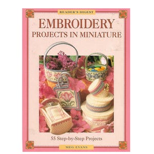 May include: The cover of a book titled "Embroidery Projects in Miniature" by Meg Evans. It showcases miniature embroidered items like baskets, a purse, and a tiered cake, set amongst pink flowers. The book is published by Reader's Digest.