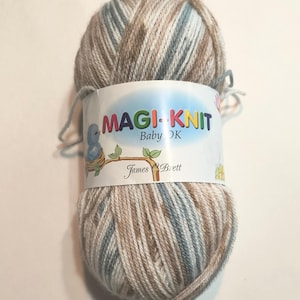 May include: A ball of brown, white, and blue yarn with a label that reads "MAGI-KNIT Baby DK James C Brett".
