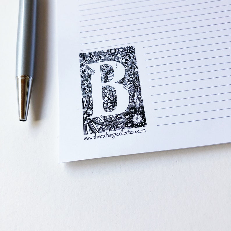 May include: Black and white illustration of the letter B surrounded by intricate floral designs. The image includes the text "www.theetchingscollection.com".