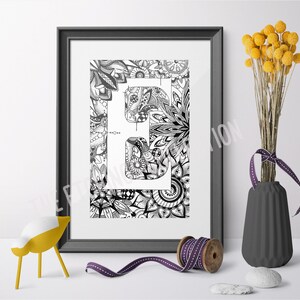 May include: Black and white printable art print featuring the letter "E" surrounded by intricate floral designs. The letter is white and the background is black.