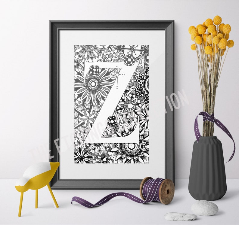 May include: Black and white printable art print featuring the letter Z surrounded by intricate floral designs. The letter Z is in a bold, sans-serif font.