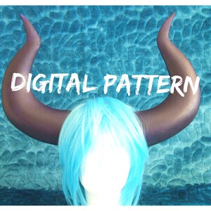 May include: Digital pattern for a pair of large, dark purple horns. The horns are curved and pointed, and they are shown on a blue background.