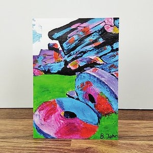 May include: Abstract painting of colorful, stacked, circular shapes on a green background. The painting is signed "B. John" in the bottom right corner.