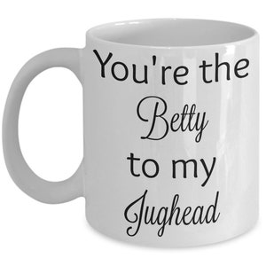 May include: White ceramic mug with black text that reads "You're the Betty to my Jughead".