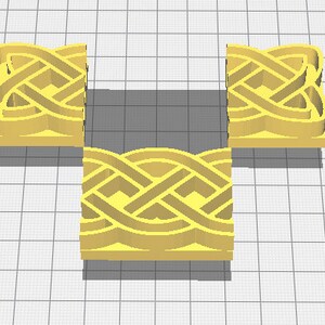 May include: Three yellow, square-shaped, decorative pieces with an intricate Celtic knot design. The pieces are made of a smooth, solid material and have a slightly raised design.