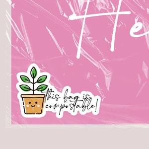 May include: Pink plastic bag with the word "Hello" written in white. A small sticker with a cartoon plant in a pot and the text "This bag is compostable!" is in the bottom left corner.