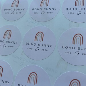 May include: A sheet of round stickers with a rainbow design and the text "BOHO BUNNY Co. ESTD 2020".