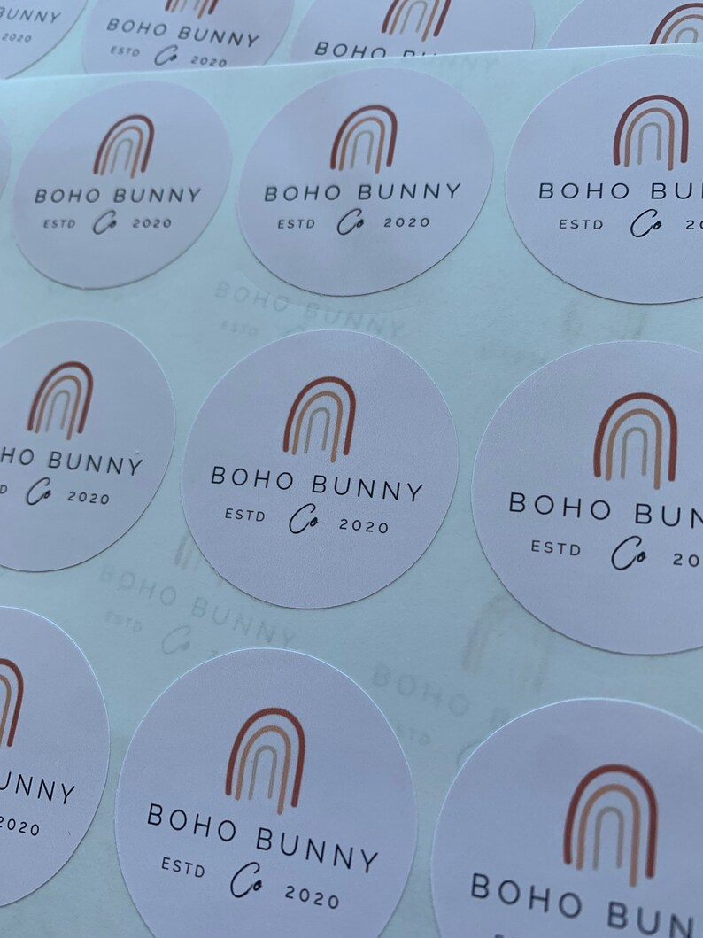 May include: A sheet of round stickers with a rainbow design and the text "BOHO BUNNY Co. ESTD 2020".