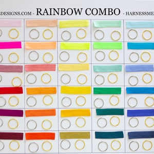 May include: A chart showing different shades of rainbow colors with the names "Pastel Rainbow", "Neon Rainbow", "Vintage Rainbow", "Rainbow", "Jewel Tone Rainbow", and "Dark Rainbow". Each color is represented by a thin strip of fabric and two small metal rings.