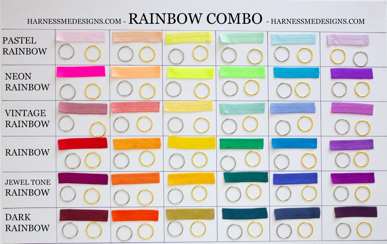 May include: A chart showing different shades of rainbow colors with the names "Pastel Rainbow", "Neon Rainbow", "Vintage Rainbow", "Rainbow", "Jewel Tone Rainbow", and "Dark Rainbow". Each color is represented by a thin strip of fabric and two small metal rings.