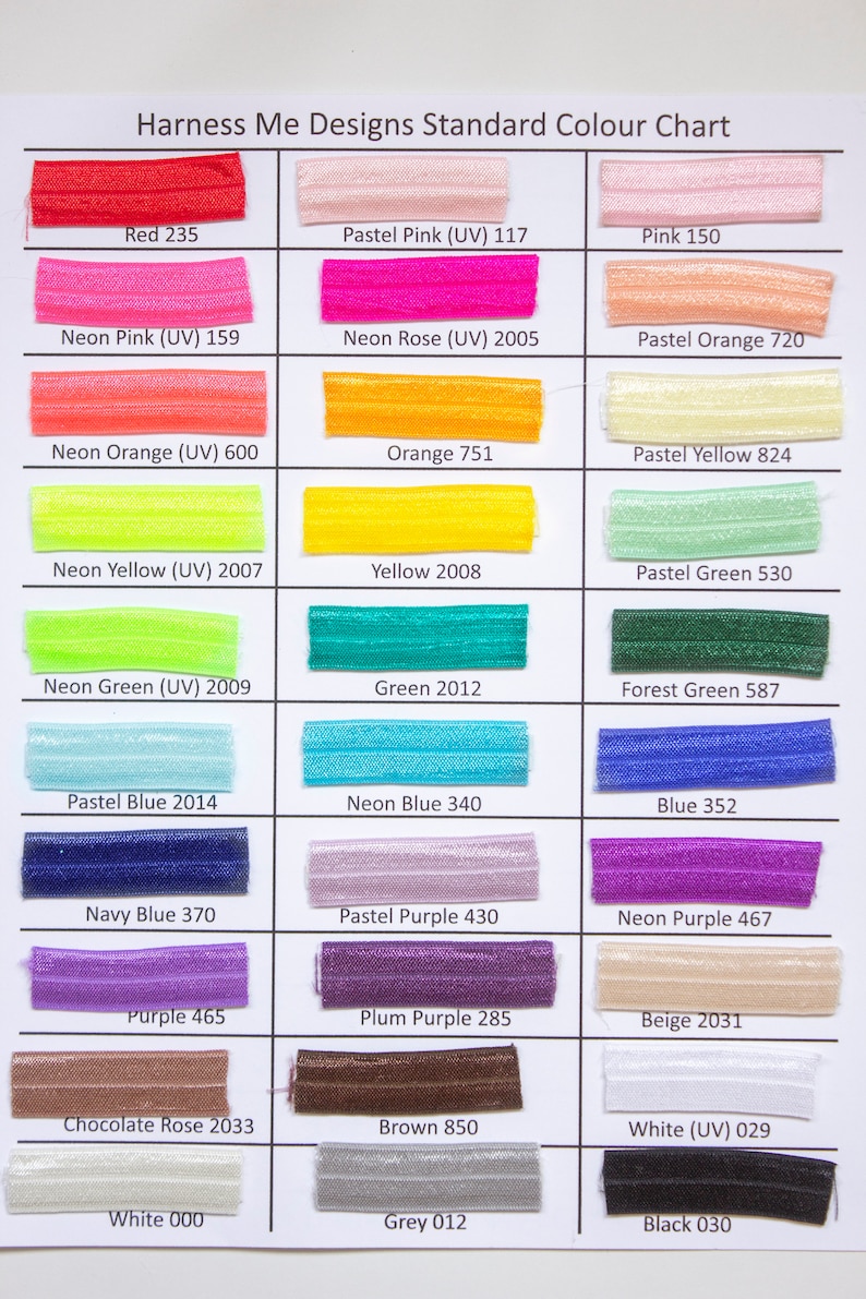 May include: A color chart with 24 different colors of elastic. The colors are arranged in three columns and eight rows. Each color has a name and a number code. The colors include red, pink, orange, yellow, green, blue, purple, brown, white, grey, and black.