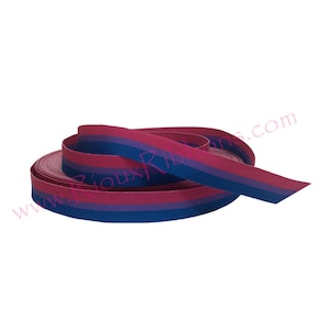 May include: A roll of pink, blue, and purple striped ribbon. The ribbon is 1.5 inches wide and is perfect for crafting, decorating, and gift wrapping.