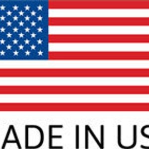 May include: The American flag with its blue field of stars and red and white stripes. Below the flag, the text "MADE IN USA" is displayed in a bold, black font.