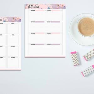 May include: Two notepads with floral accents and text reading "Important Dates" and "Gift Ideas." A cup of coffee, a pencil, and three patterned erasers are also on the white surface. The notepads have pink and purple borders.