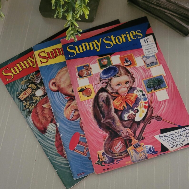 Three vintage Sunny Stories children's books with colorful covers. The front cover of the book on top features a monkey holding a paintbrush and palette. The text on the cover reads "Sunny Stories 6".