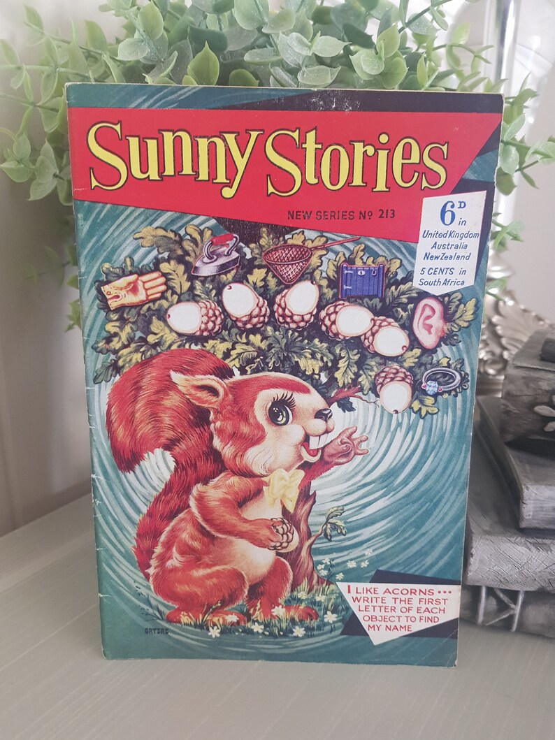 A vintage children's book cover Sunny Stories featuring a cartoon squirrel holding an acorn. The cover is blue and green with a swirling pattern. The title "Sunny Stories" is printed in yellow letters. The book is from a new series, number 213.