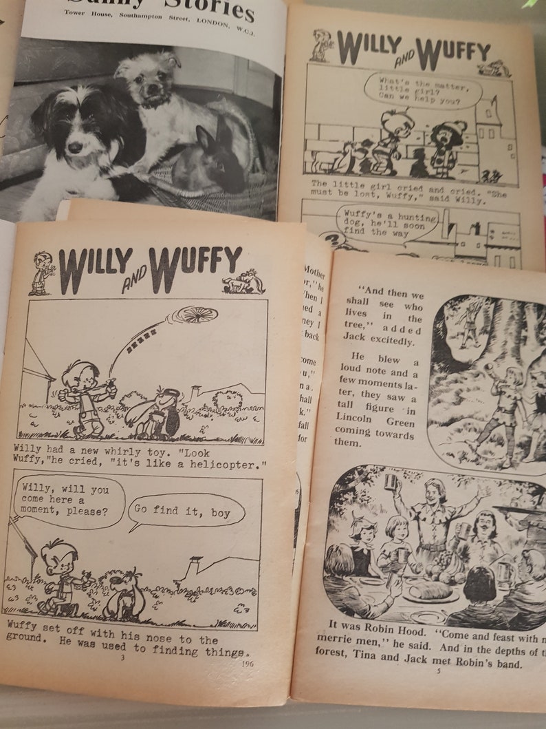 May include: A black and white comic book page featuring a cartoon dog named Willy and his friend Wuffy. The comic book is titled "Willy and Wuffy" and features a story about a lost girl and a hunting dog. The comic book is from the 1950s or 1960s.