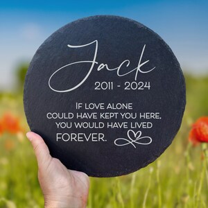 May include: Black slate memorial plaque with the name "Jack" and the dates "2011-2024" engraved in white. The plaque also includes the text "If love alone could have kept you here, you would have lived forever." with a heart symbol.