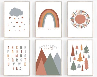 May include: Six framed art prints with a neutral color palette. The prints feature a cloud with heart rain, a rainbow with the text "you are my sunshine", a sun, the alphabet, mountains with the text "adventure awaits", and trees.