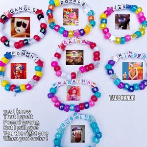 May include: A collection of colorful beaded bracelets with character images and names like "Gangle," "Zooble," and "Jax." Each bracelet features a different color scheme and star-shaped accents. The text "TADC KANDI!" is also visible.